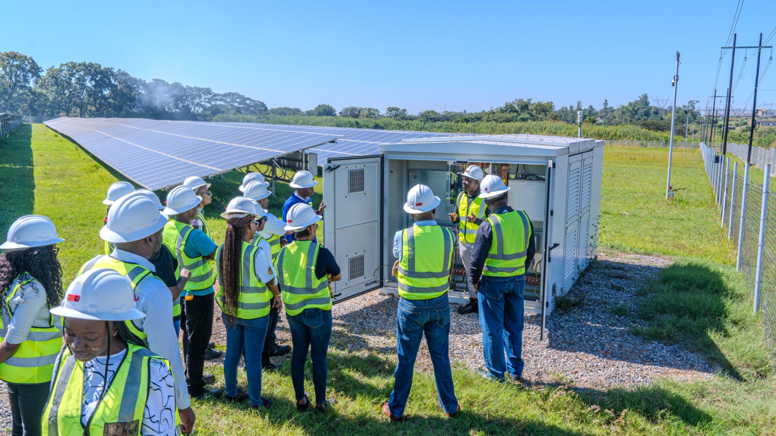 The mission team inspecting site the Copperbelt Energy Cooperation's solar panels