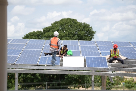 Engineers install solar panels