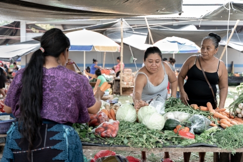 three women at a market