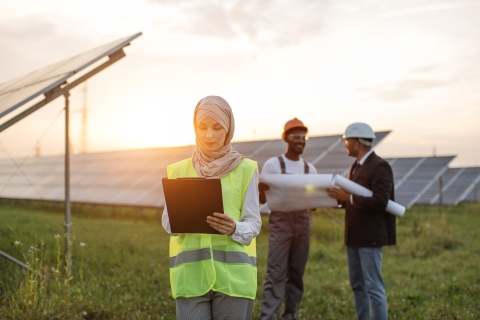 Workers at solar panels