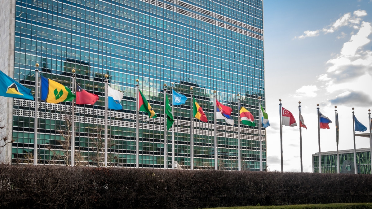 UN Headquarters building with flags of nations
